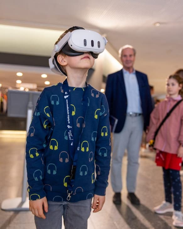 Child with VR headset experiencing immersive 3D audio installation.
