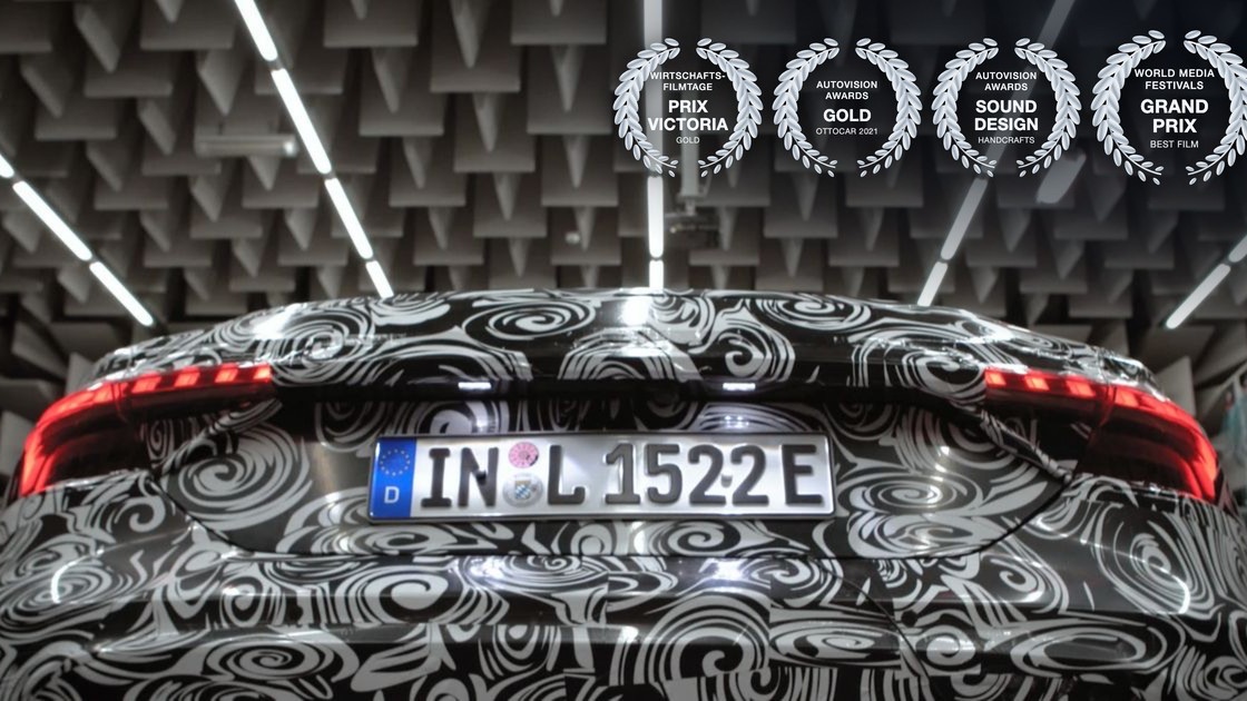 Audi e-tron GT in the anechoic chamber at Audi in Ingolstadt, with laurels for Prix Victoria, Ottocar Gold, a sound design award and the Grand Prix of the World Media Festivals