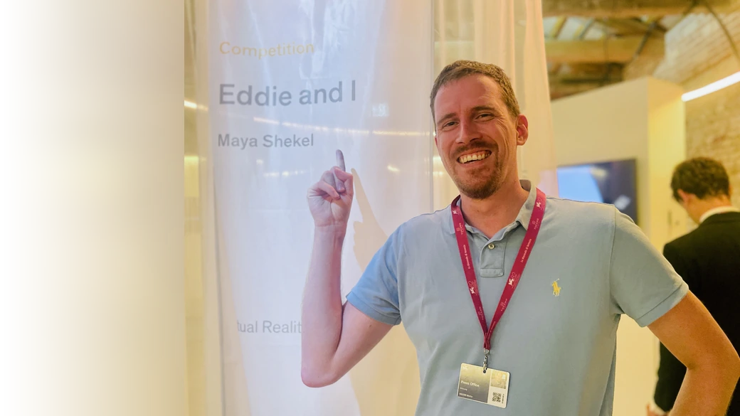Martin Rieger next to the Eddie and I competition banner at Venice Immersive 2025